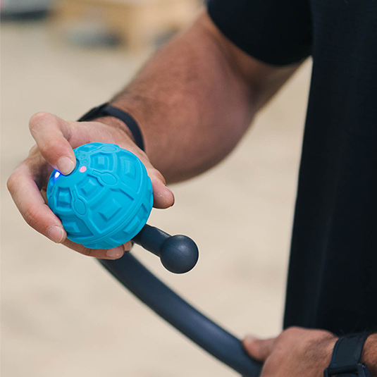 vibrating massage ball being turned on