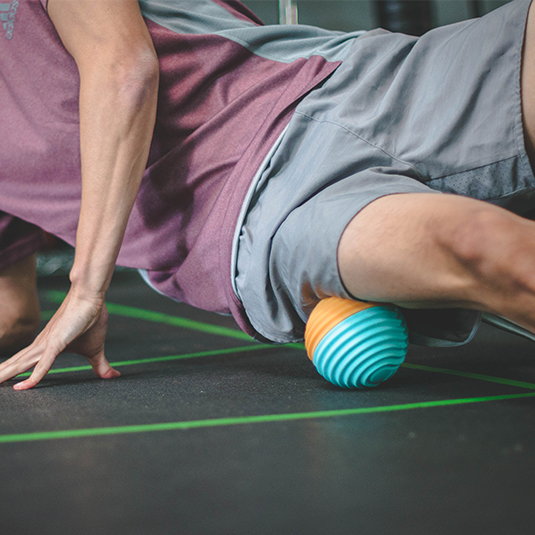 using vibrating massage ball on IT bands