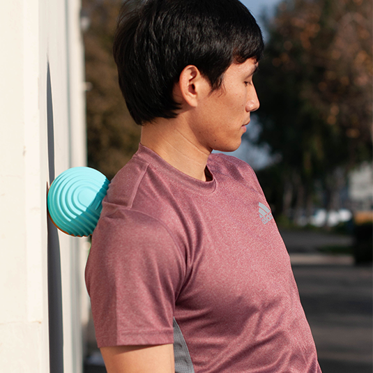 vibrating massage ball to treat shoulder soreness