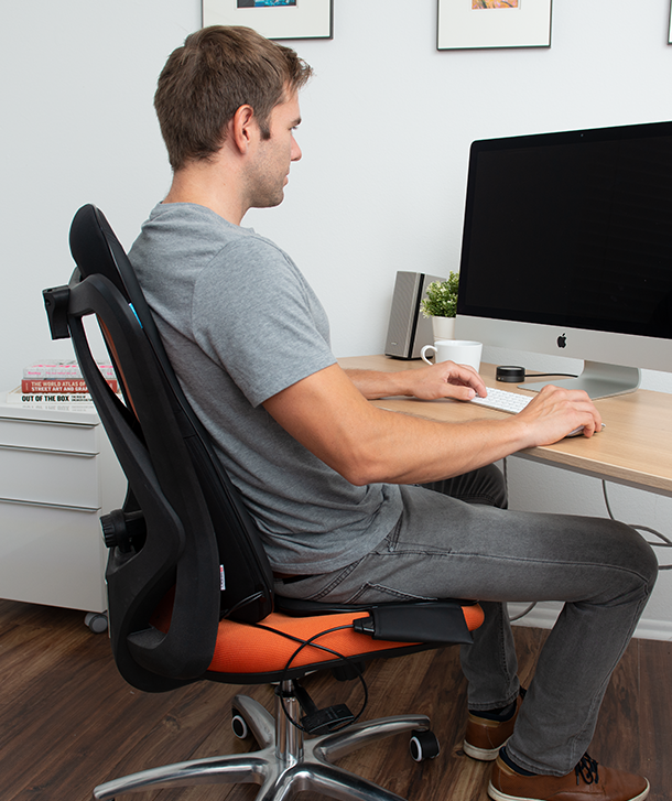 person working with the heated seat massaging their lower back